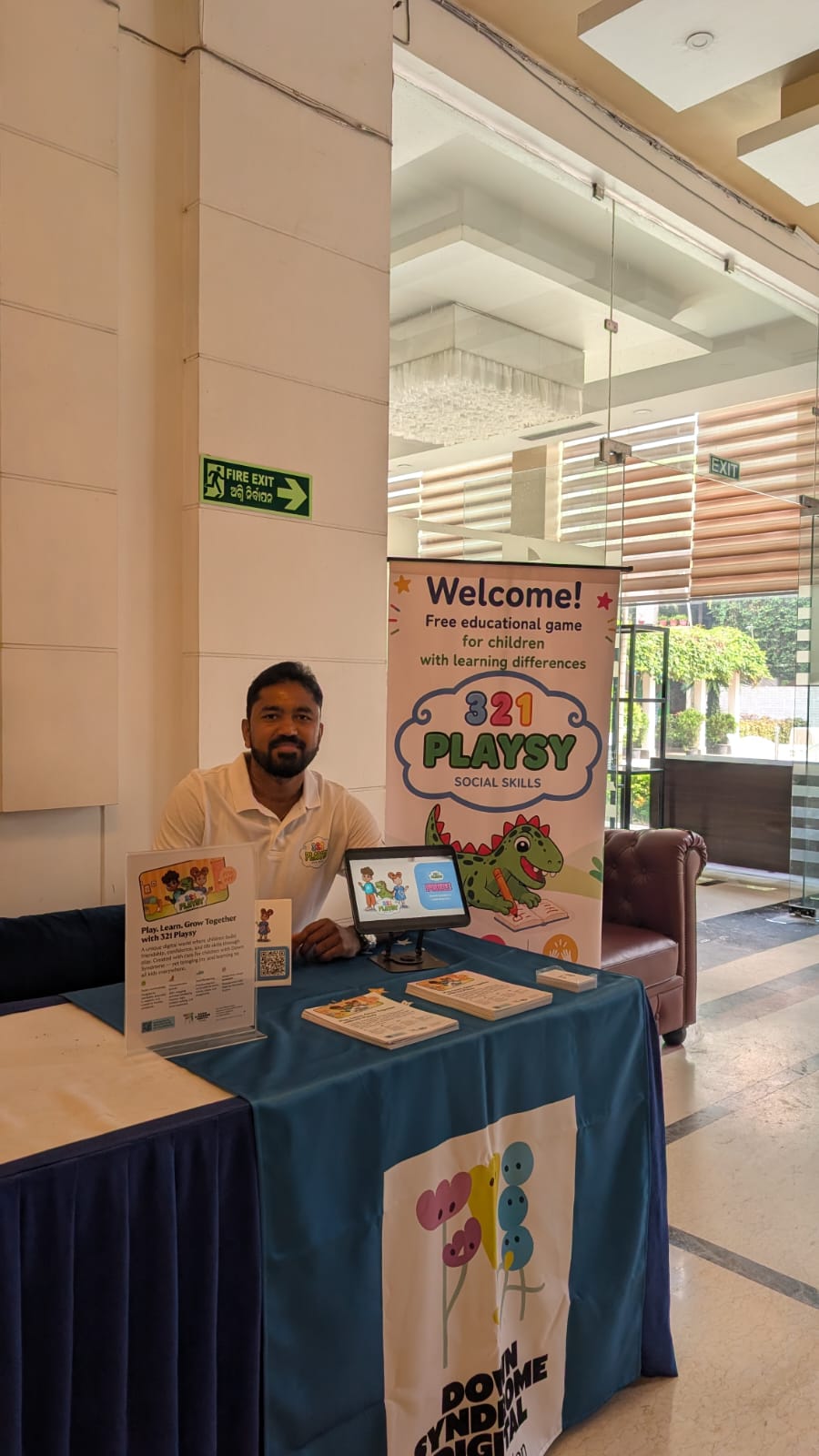 Families and conference attendees visiting the Down Syndrome Digital table