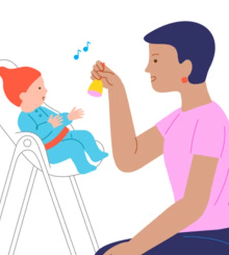 A baby watches a caregiver hold a gentle jingle toy during play.