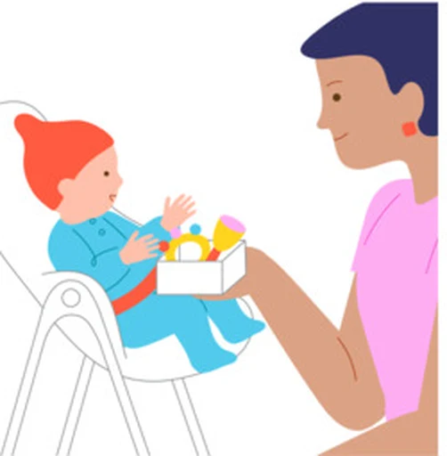 A caregiver offers a baby a choice of large, baby-safe toys.