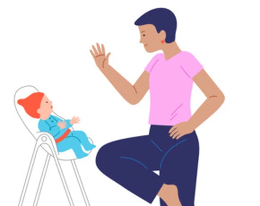 A caregiver waves to a baby during supervised play.