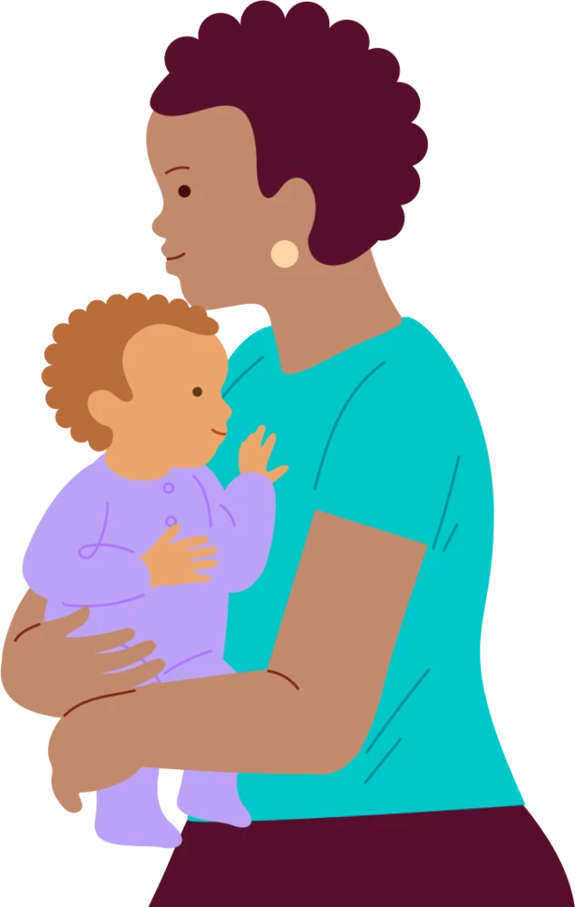 A caregiver holds a baby securely while sitting together.